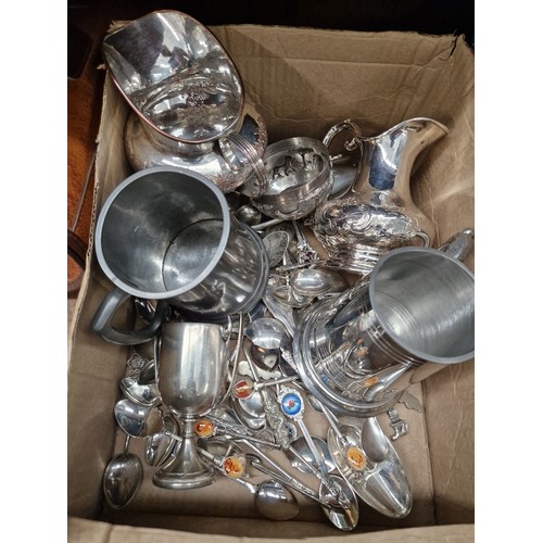 40 - A box containing silver plated ware, pewter tankard, etc.