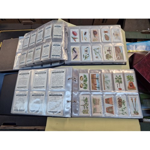 46 - 2 albums containing 20 complete sets of Wills cigarette cards including Merchant Ships of the World,... 