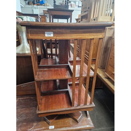 876 - An early 20th century revolving bookcase, height 76cm.