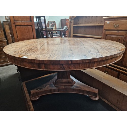 882 - A 19th century rosewood breakfast table, single pedestal and triform base, diameter 132.5cm & height... 