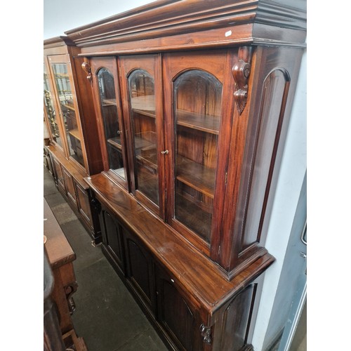 885 - A reproduction hardwood cabinet bookcase, width 171cm, depth 50cm & height 212cm.