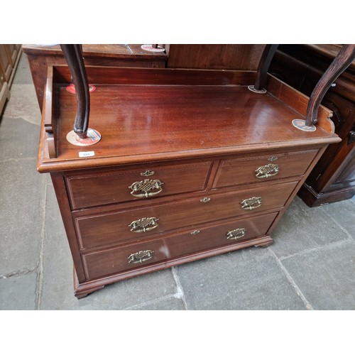 895 - An early 20th century mahogany chest of drawers with brass handles and rail back and sides, width 10... 