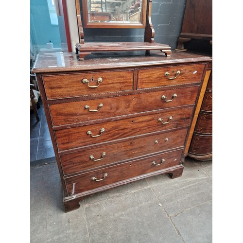 890 - A George III mahogany chest of drawers with campaign style brass carry handles to sides, brass swan ... 