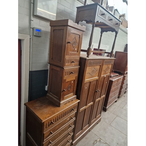 888 - A Priory style oak bedroom suite.