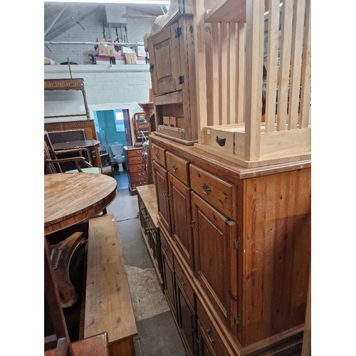 899 - Two pine dressers (one with plate rack back), an AV cabinet and a kitchen side table.