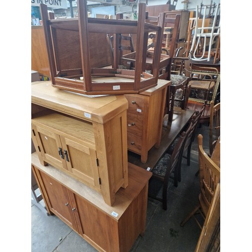 918 - Assorted furniture comprising a light wood cabinet, a light wood chest of drawers, a light wood AV c... 