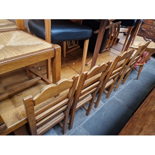 912 - A modern light oak farm house table and six chairs.