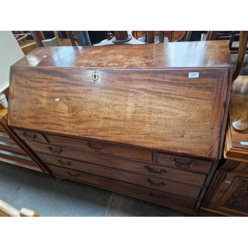 910 - A Georgian mahogany bureau.