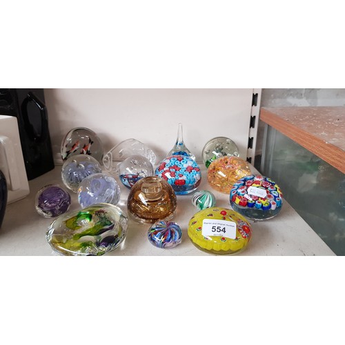 554 - 16 glass paperweights