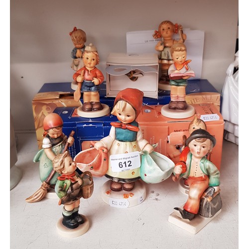 612 - 9 Hummel figurines and a boxed ‘Bee Badge (issued year 2000 - figurines include ‘Merry Wanderer’ 195... 