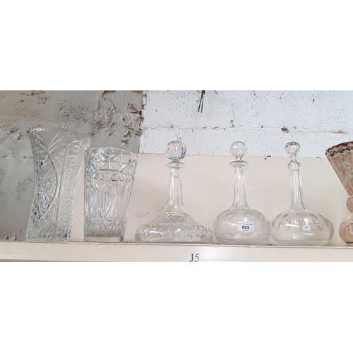 605 - 2 cut glass vases, ships decanter and two other decanters