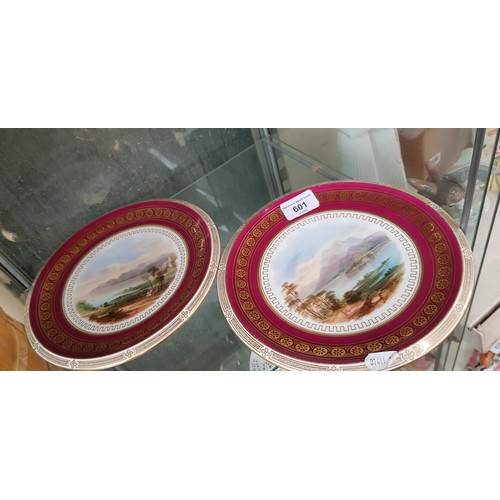 601 - A pair of 19th century Davenport china plates, each decorated with a scene depicting a Scottish Loch