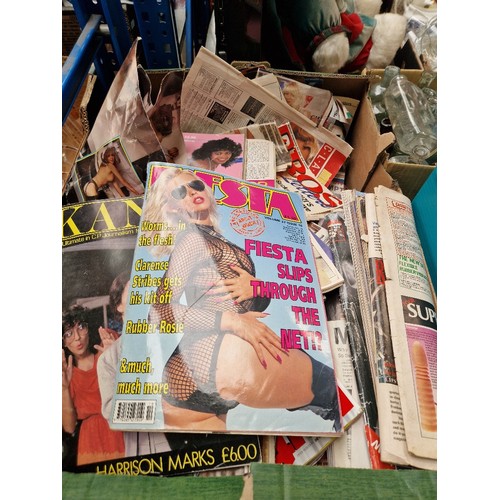 144 - A box of adult magazines.