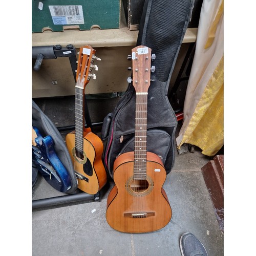 161 - A Fender Squier 3/4 szi travel acoustic guitar together with an electric guitar body and a half size... 