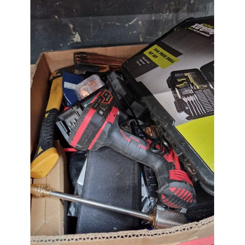 130 - A box of tools, cordless drill, an axe and a cased drill bit set.