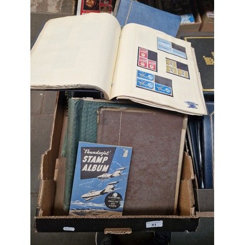 81 - A box of stamp albums with stamps.