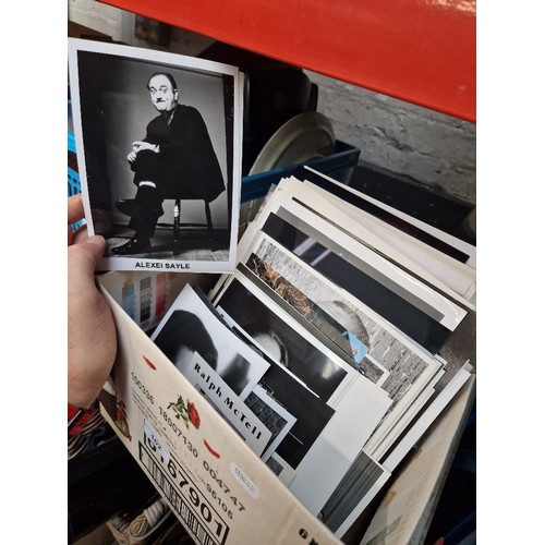 102 - A box of assorted press photographs.