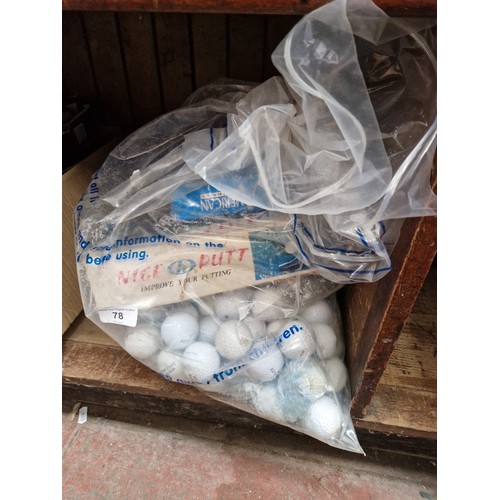 78 - A bag of golf balls.