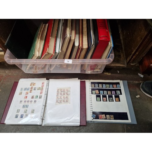 74 - A box of assorted stamp albums.