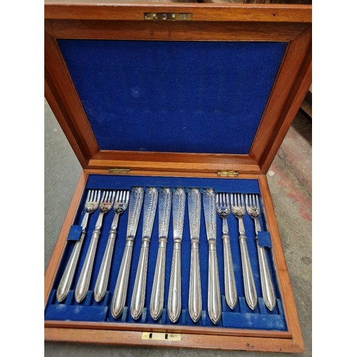 73 - A Victorian mahogany cased set of silver plated fish knives and forks.