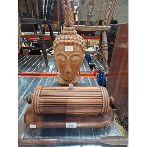 962 - An Eastern carved wood bust of Buddha together with a wooden lidded container.