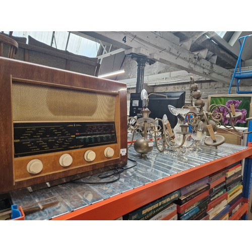 963 - Two brass ceiling light fittings, a glass chandelier and a vintage radio.