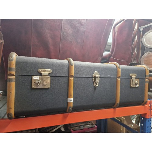 954 - A vintage beech bound travel trunk.