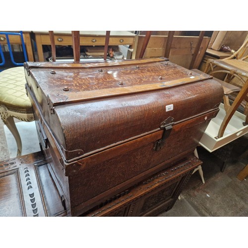 941 - A metal travel trunk with simulated oak paintwork.