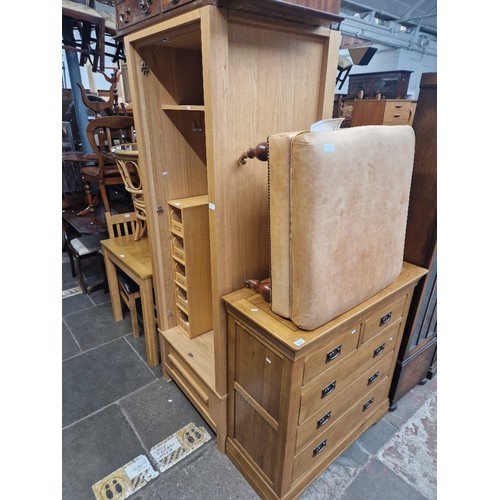 943 - A modern light oak single wardrobe together with an oak chest of drawers.