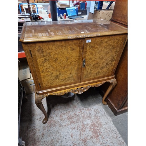 947 - A vintage walnut cocktail/drinks cabinet.