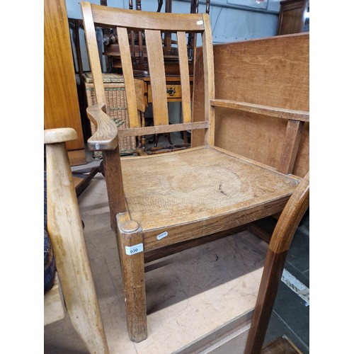 930 - An early 20th century Waring & Gillow oak fireside chair.