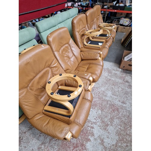 985 - A German Himolla tan leather recliner sofa and two matching recliner armchairs with three footstools... 