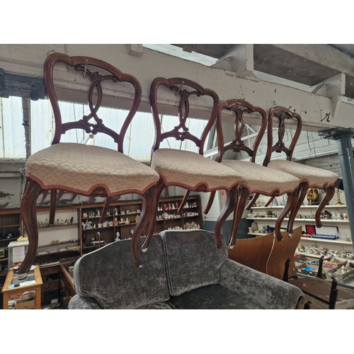 981 - A set of four Victorian walnut chairs with cabriole legs.