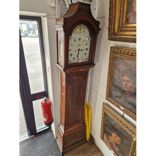 845 - A Georgian eight day carved oak longcase clock with weights and pendulum.