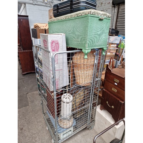 414 - A cage of items (Cage not included), bedding box, moses basket, Kirby vacuum cleaner Classic 3 with ... 