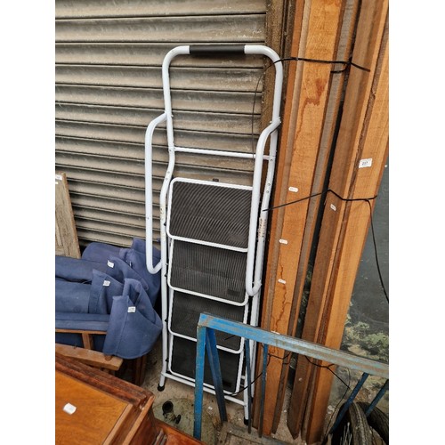 416 - A set of metal step ladders