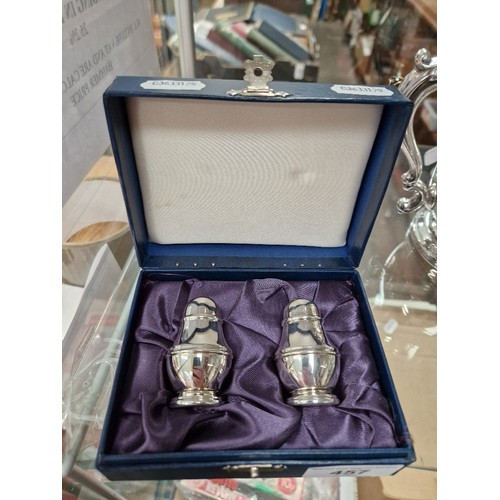 457 - Hallmarked silver salt & pepper pots, in presentation box, gross weight 76g.