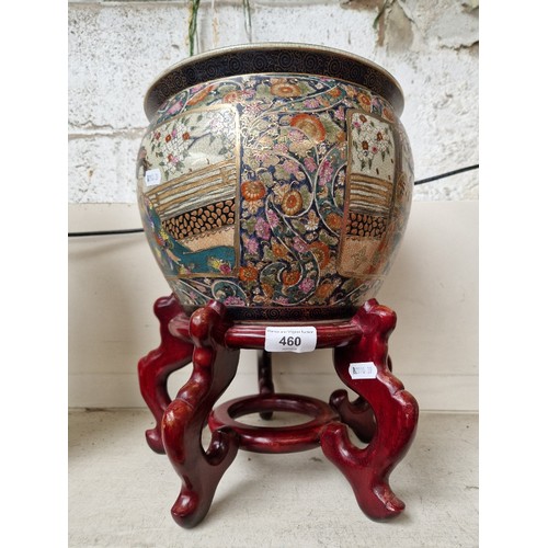 460 - A Japanese Satsuma crackle glazed fish bowl on stand, decorated with Geisha.