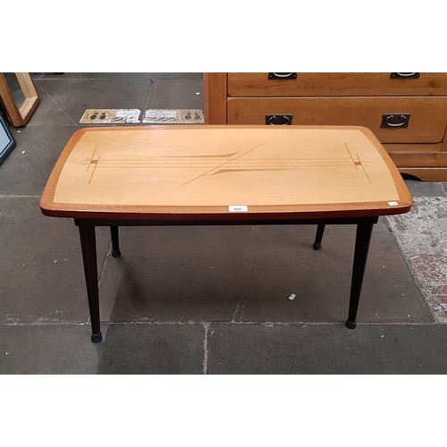 995 - A mid 20th century coffee table with inlaid teak and sycamore top.