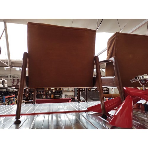 978 - A set of four mid 20th century teak lounge armchairs.