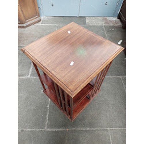 876 - An early 20th century revolving bookcase, height 76cm.