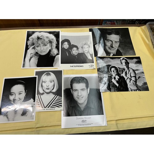 102 - A box of assorted press photographs.