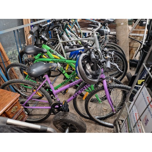 431 - Two Gemini mountain bikes, one gents and and one ladies, complete with helmets.