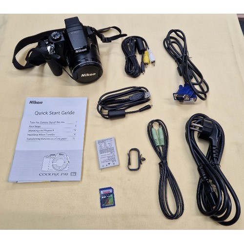 7 - A Nikon Coolpix P90 camera, appears to be un-used with accessories.