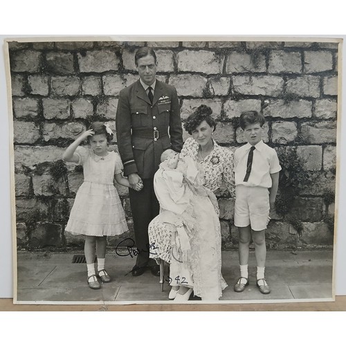 114 - King George VI, an autographed press photograph depicting the King with family, signed and dated 194... 