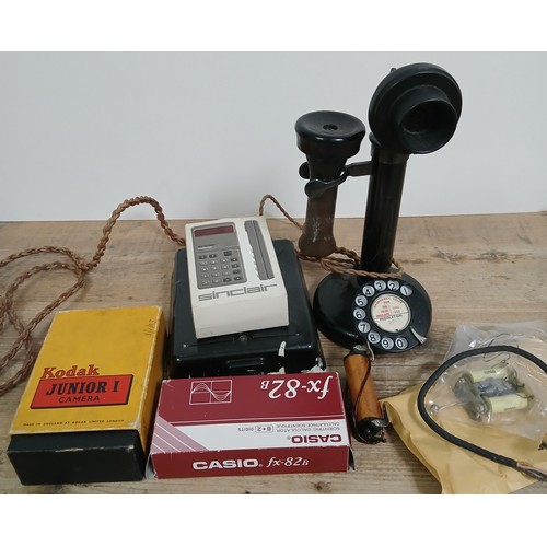 197 - A mixed lot including an early 20th century still type telephone, glass photographic slides, vintage... 