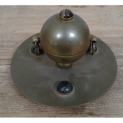 235 - An Arts & Crafts style brass inkwell with hardstone cabochons, diameter 15.5cm.