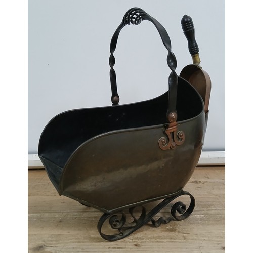 227 - A wrought iron and copper coal scuttle, registered design number 127757, with associated shovel, hei... 