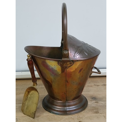 226 - An Arts & Crafts copper coal scuttle by Benham & Froud, height 52cm, with associated shovel.