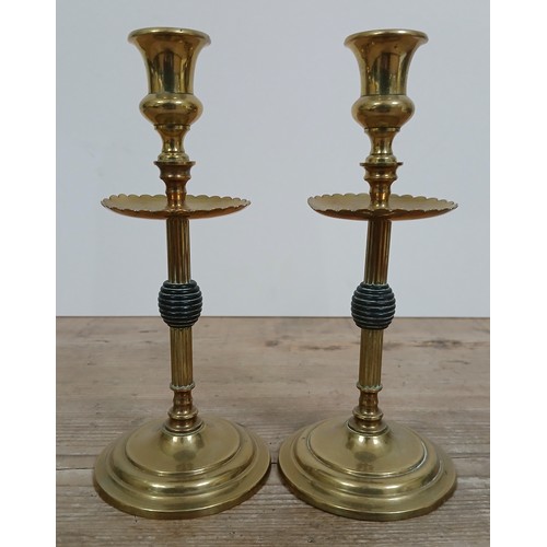 232 - A pair of Aesthetic brass candlesticks, height 21cm.